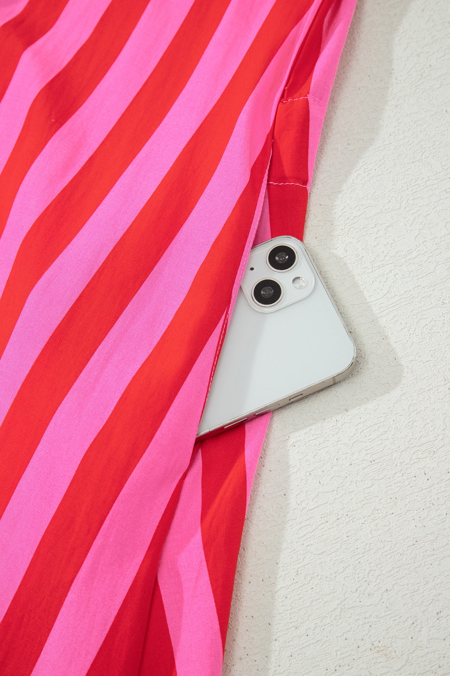 Pink and red striped long-sleeve mini dress with button placket detail