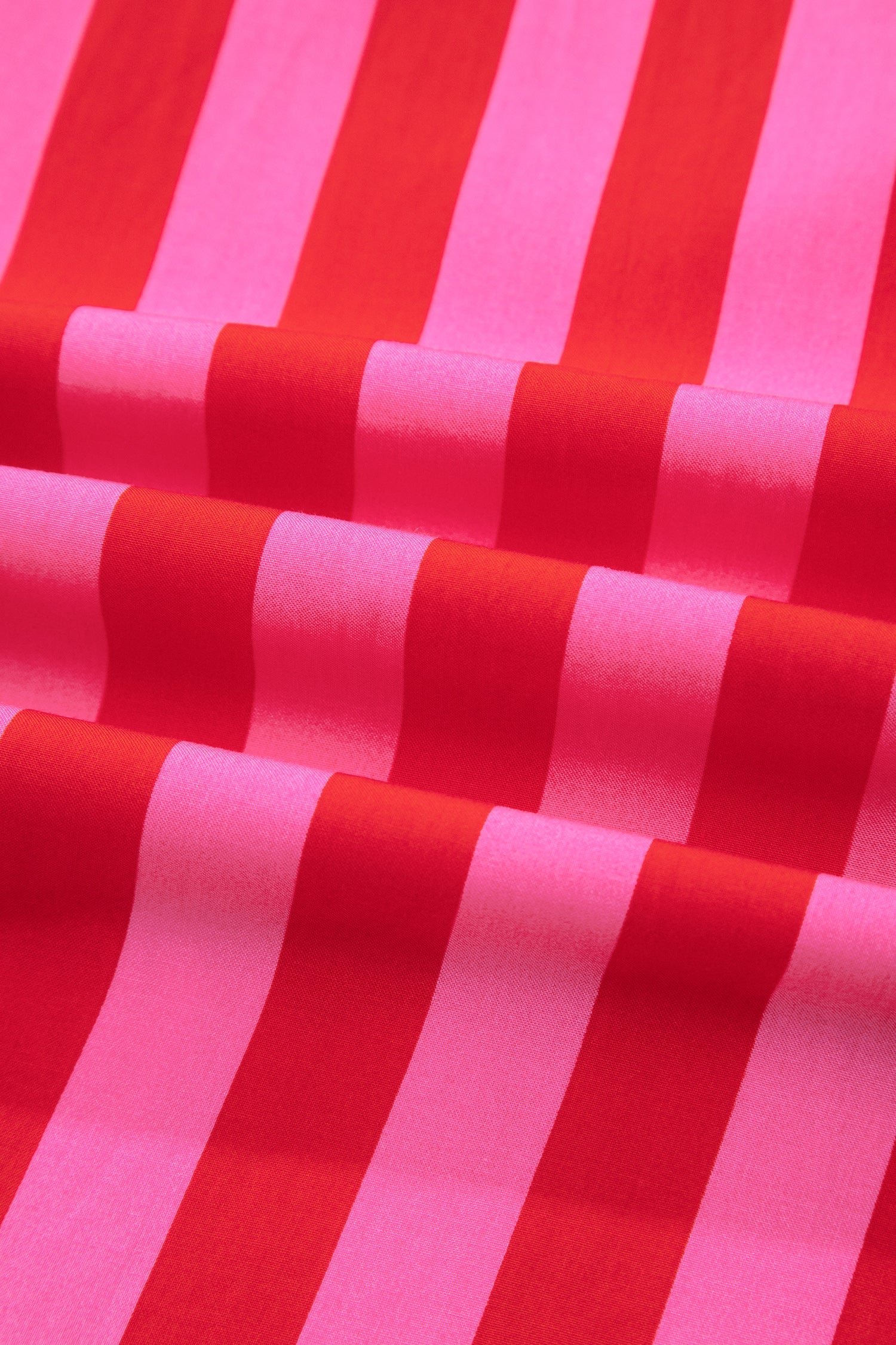 Close-up of pink and red vertical striped fabric