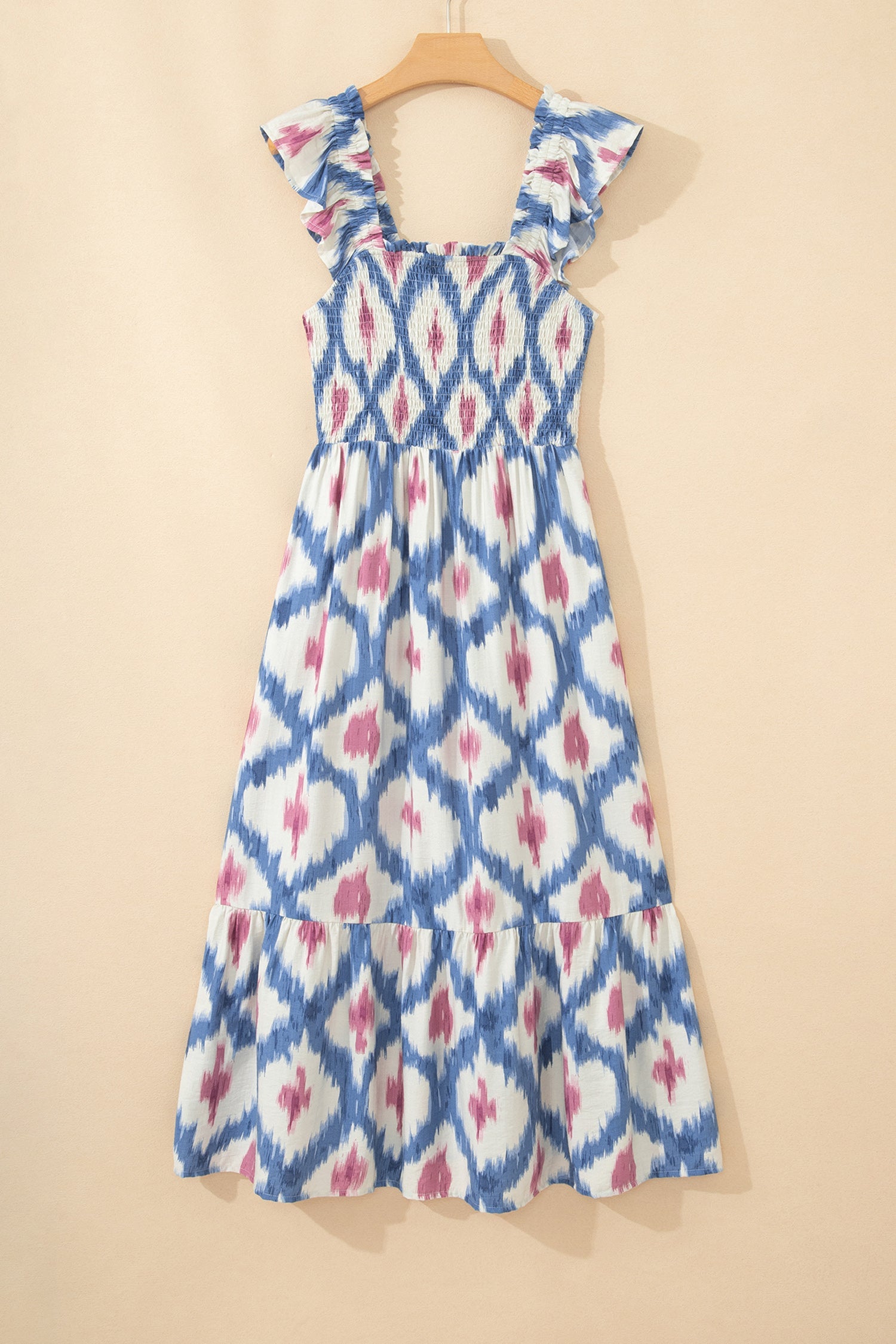Sky blue ikat-pattern midi dress on hanger with ruffle cap sleeves