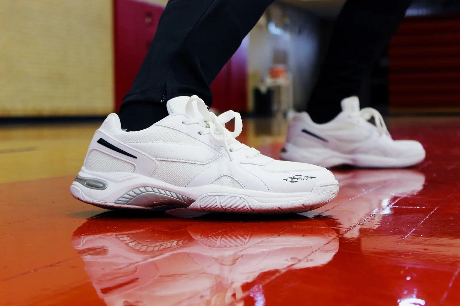 Men's white walking shoes with lace-up uppers and gray traction sole