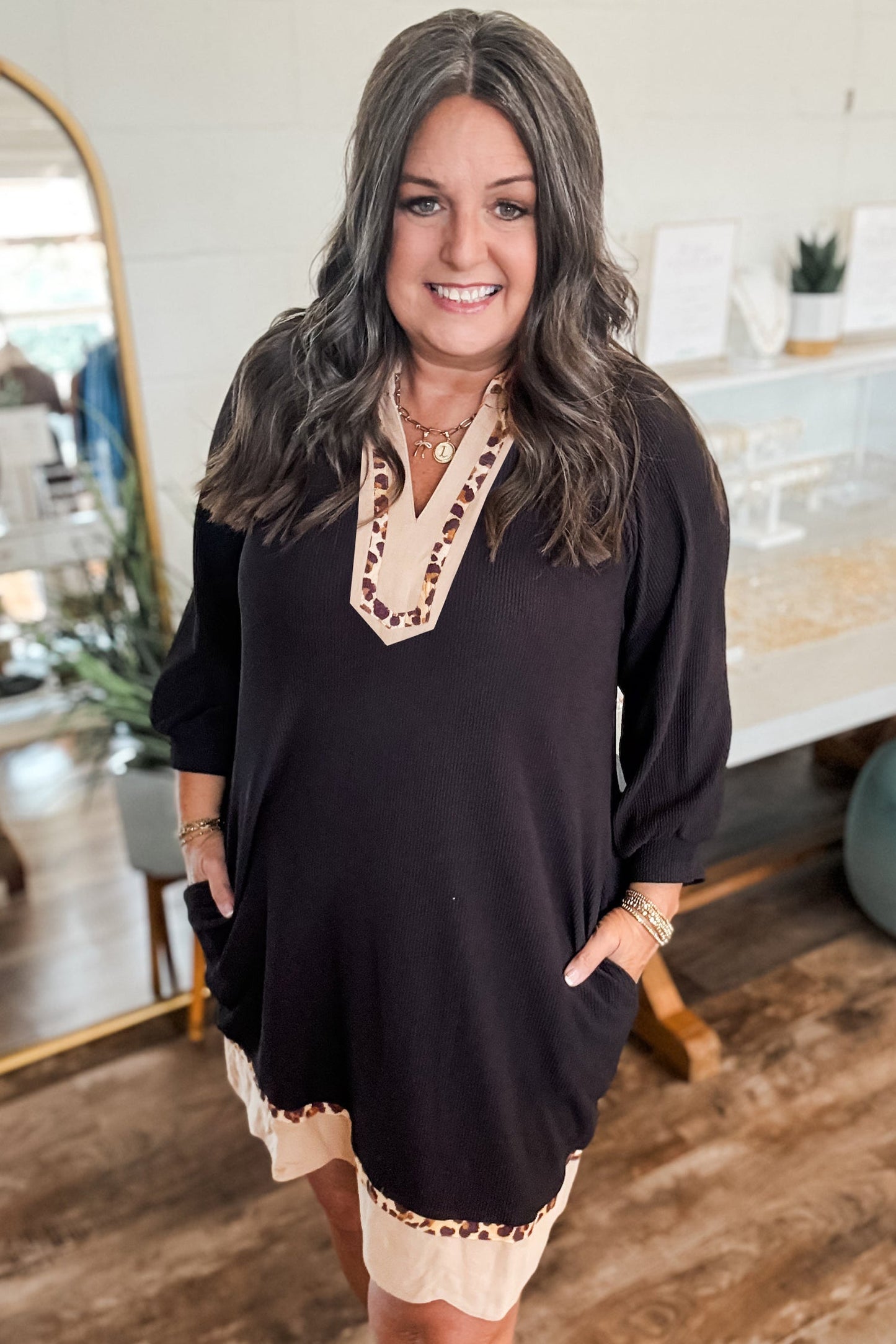 Black plus-size ribbed dress with V-neck and leopard block trim, three-quarter sleeves