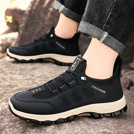 Lightweight travel shoes in black with elastic collar and textured rubber sole
