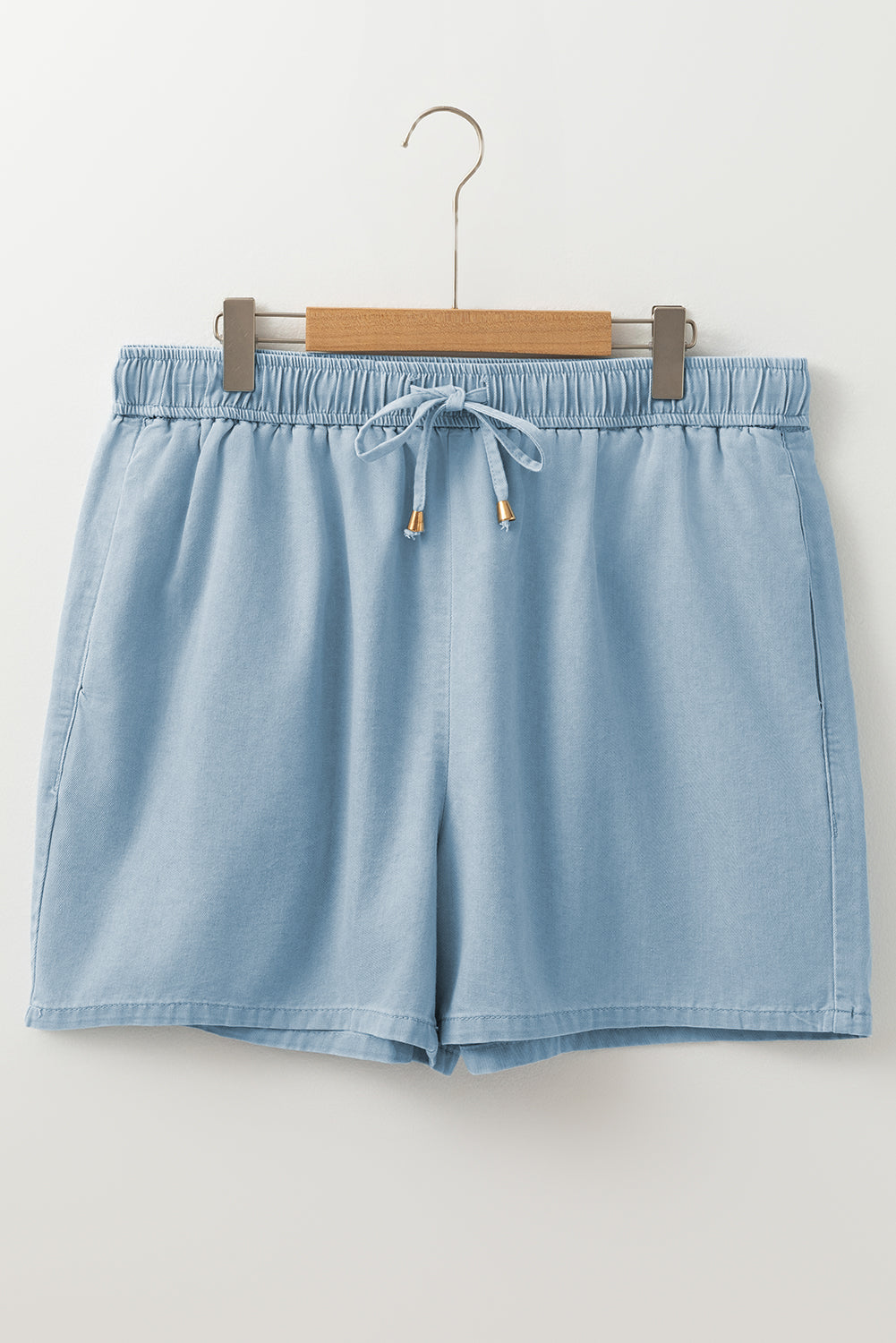 Washed chambray shorts front view with elastic waist and drawstring, blue
