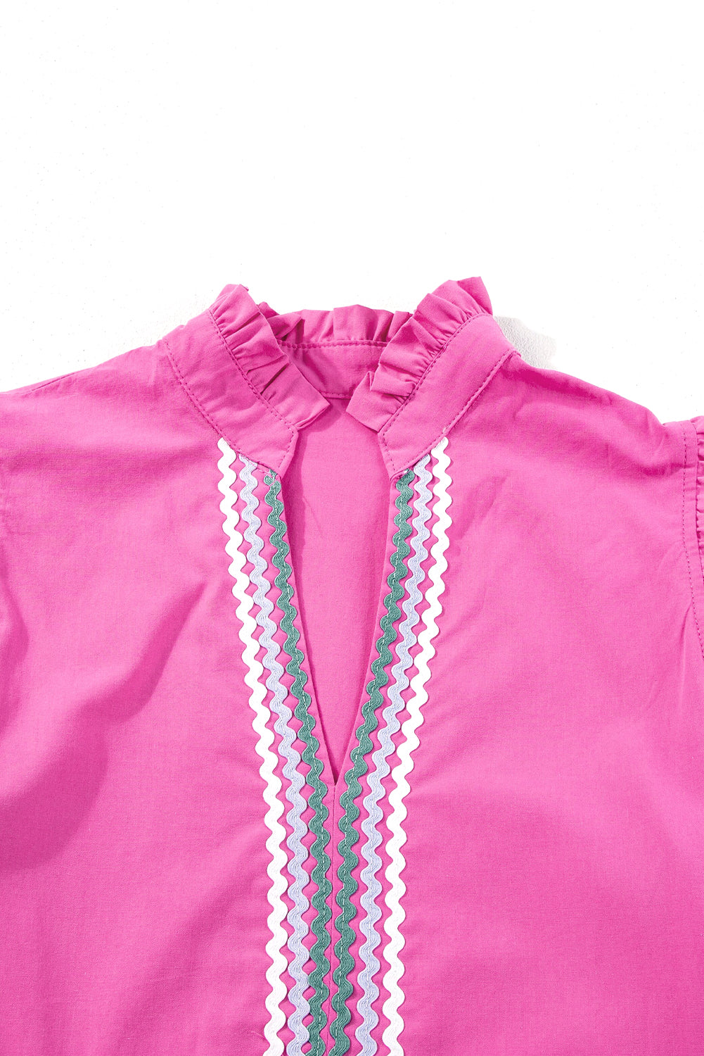 Back view of strawberry pink V-neck dress with contrasting zigzag trim detail