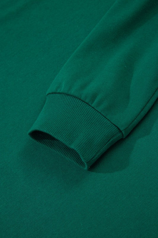 Green pullover sleeve with ribbed cuff hem