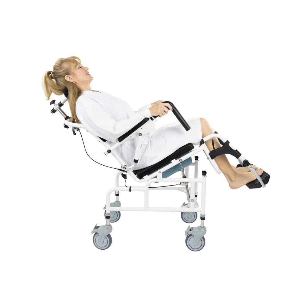 Reclined rolling shower commode chair with black seat, flip-up armrests, leg straps