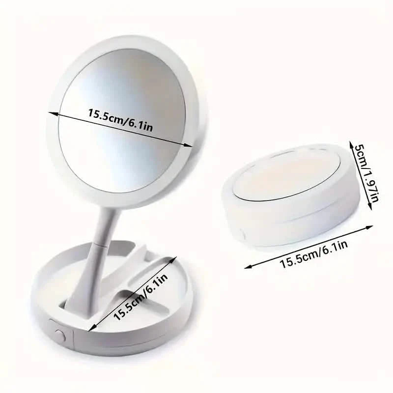 White foldable LED vanity mirror with round magnifying head and compact base