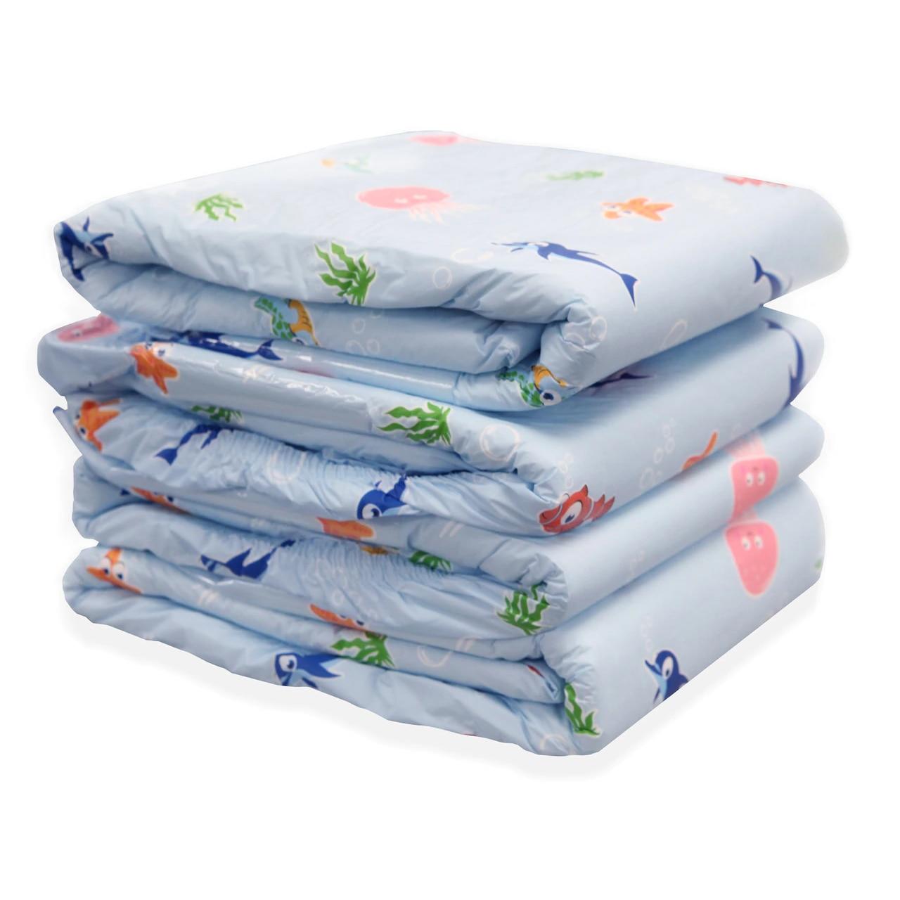 Stack of Under the Sea adult diapers in light blue with fish and coral print