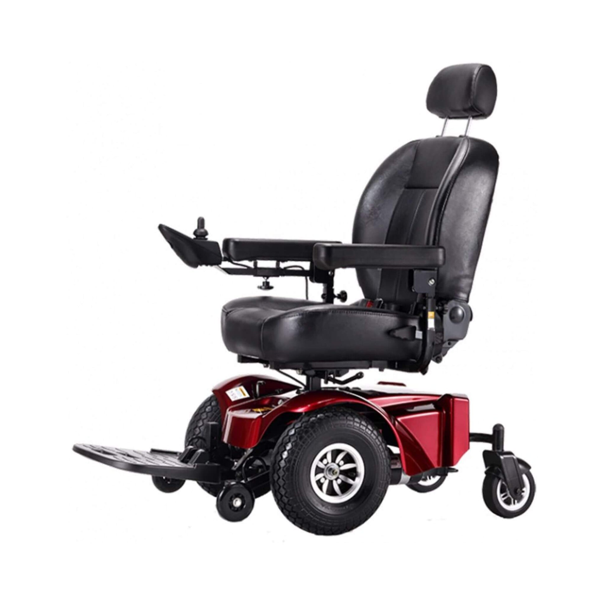 Side view of red power wheelchair with black padded seat, armrests, and large front wheels
