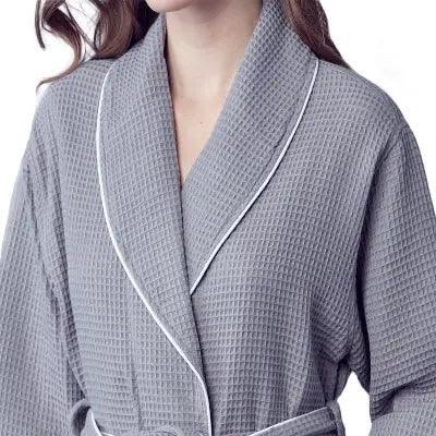 Women’s waffle bathrobe with white piping, gray textured robe with V-neck wrap.