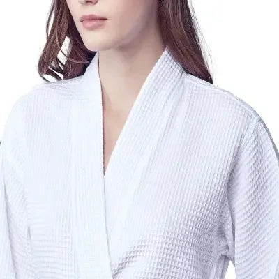 Close-up of women’s white waffle robe collar and V-neck with textured waffle fabric