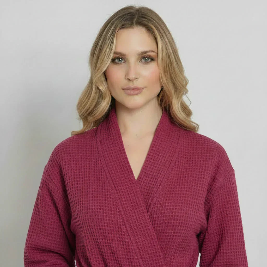 Women’s waffle robe in wine red, V-neck wrap style with tie belt.