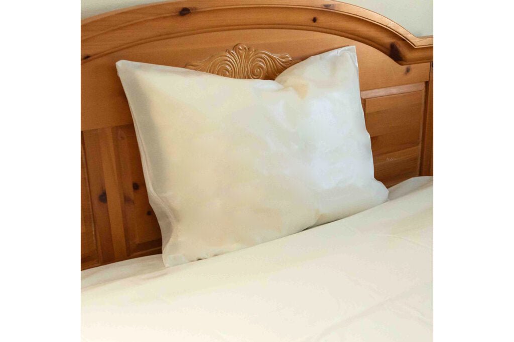 Milky white heavy duty vinyl pillow cover with stitched border and hidden zipper