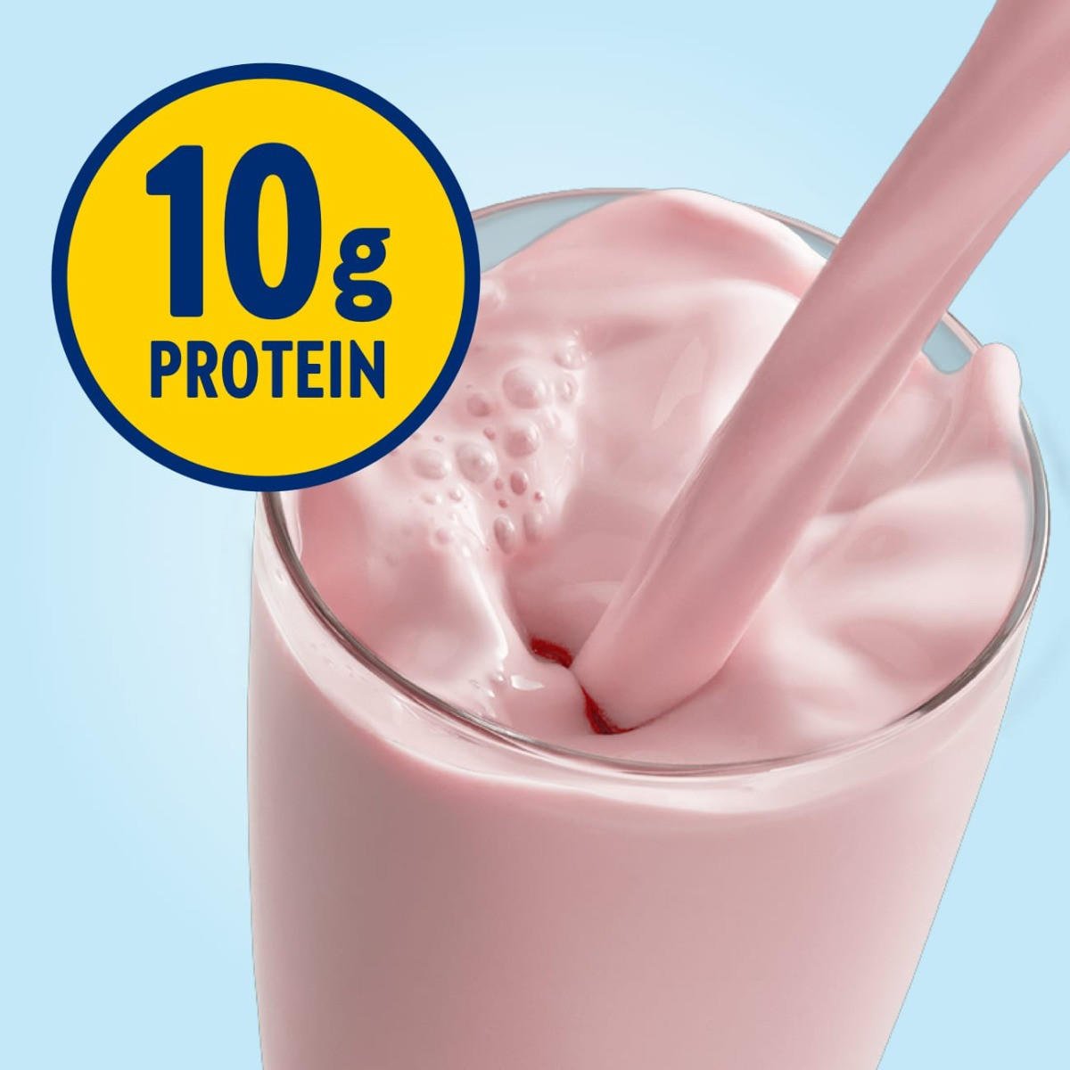 Creamy strawberry Glucerna shake in a glass with 10g protein label