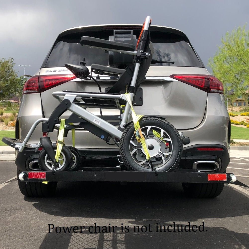 Wheelchair lift arm with extended ramp and platform at rear of vehicle
