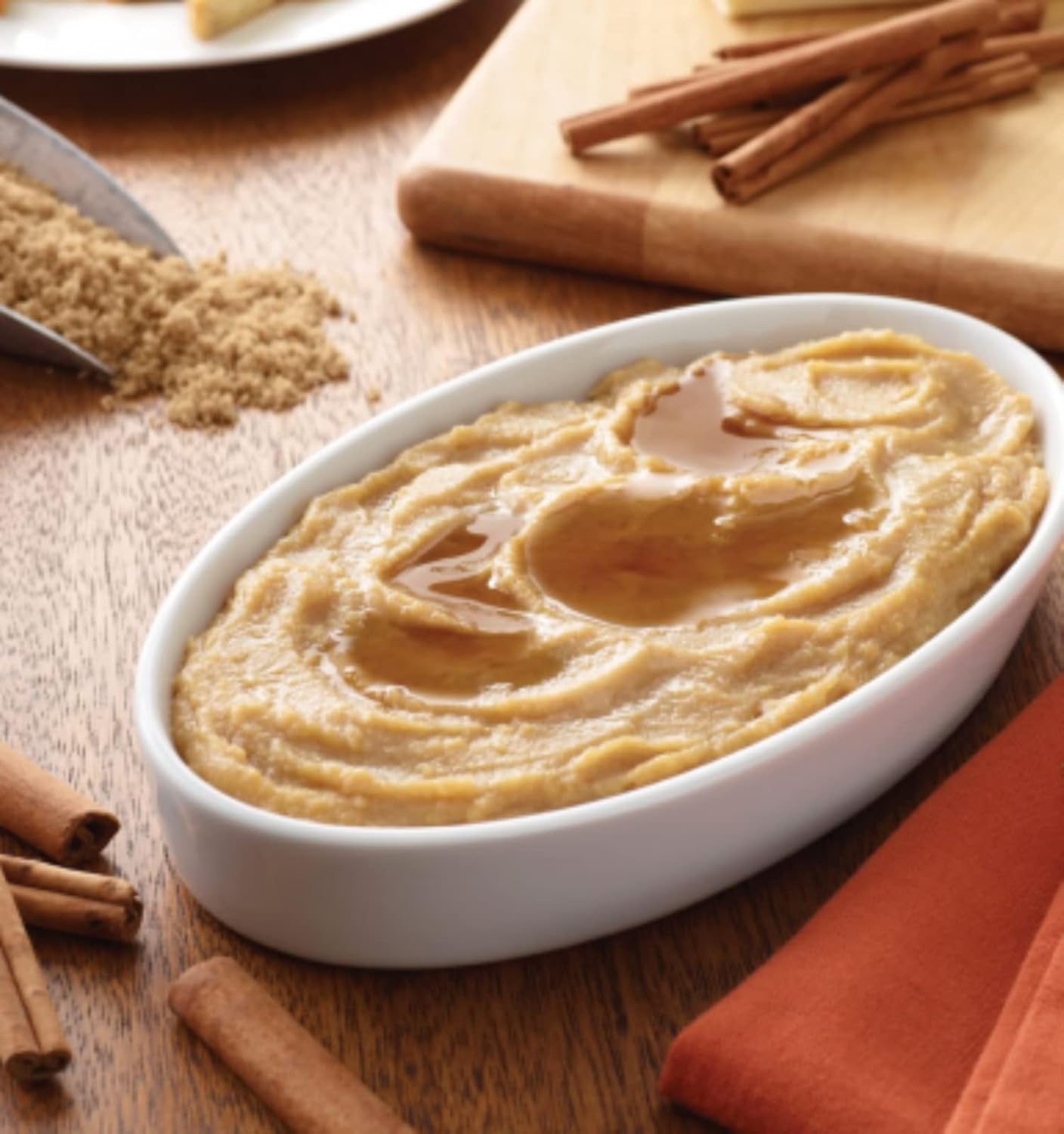 Bowl of thick French toast puree with maple cinnamon topping, spoonable texture