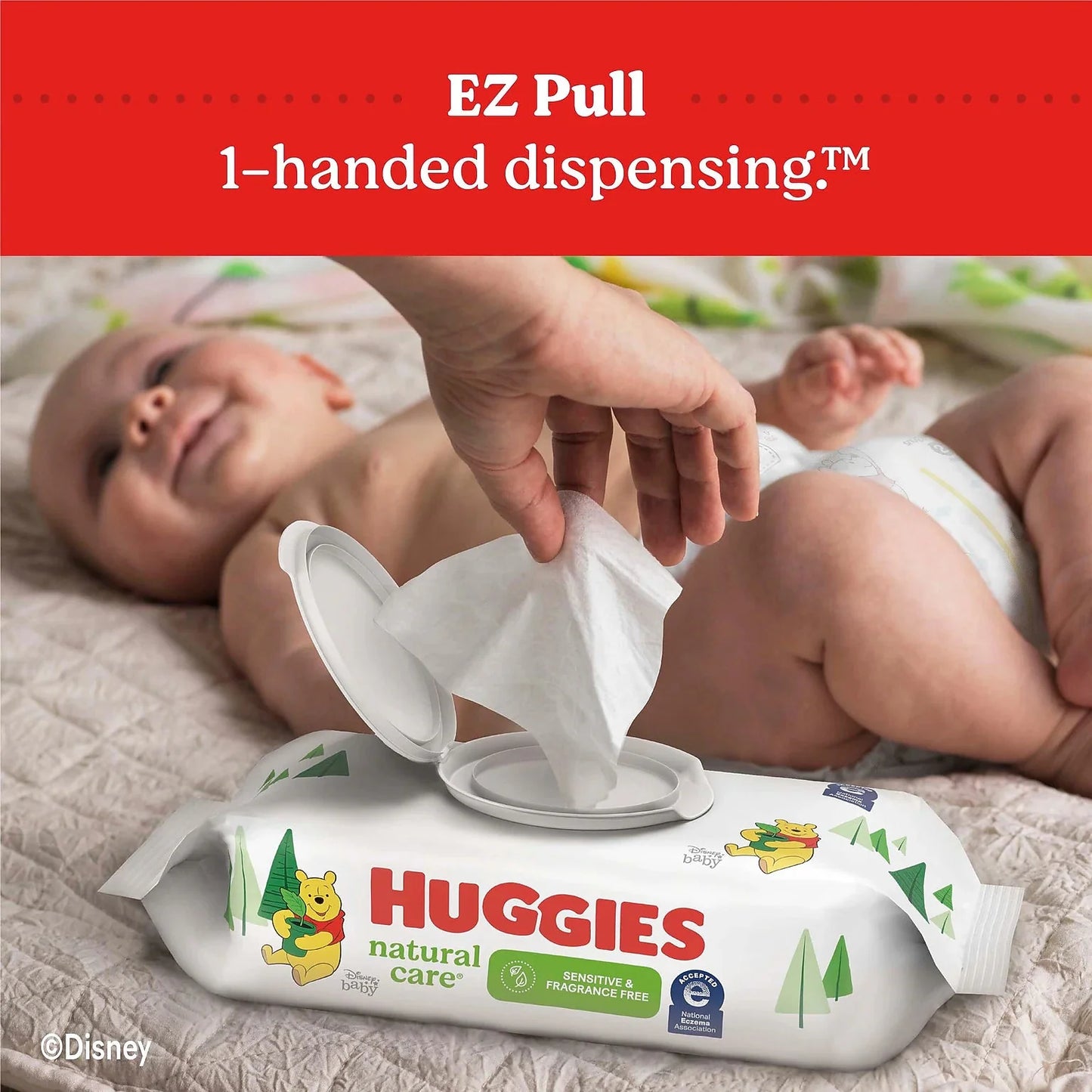 Baby wipes dispenser pack dispensing a wipe, EZ Pull one-handed dispensing