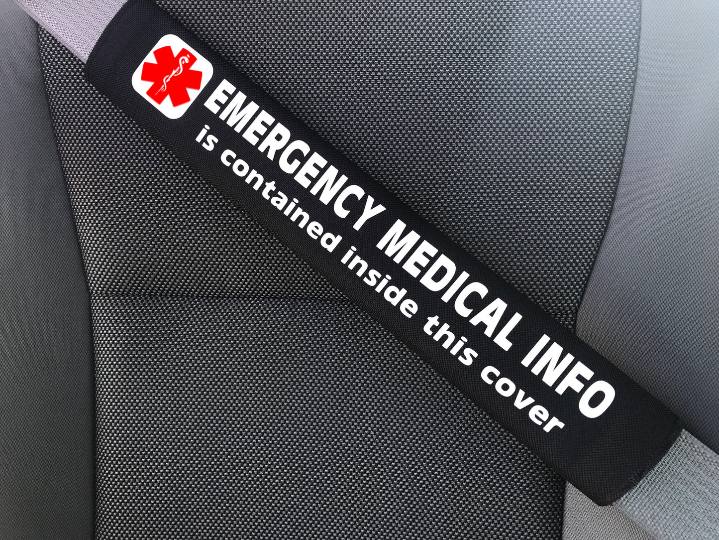 Medical alert seat belt cover with Emergency Medical Info strap label