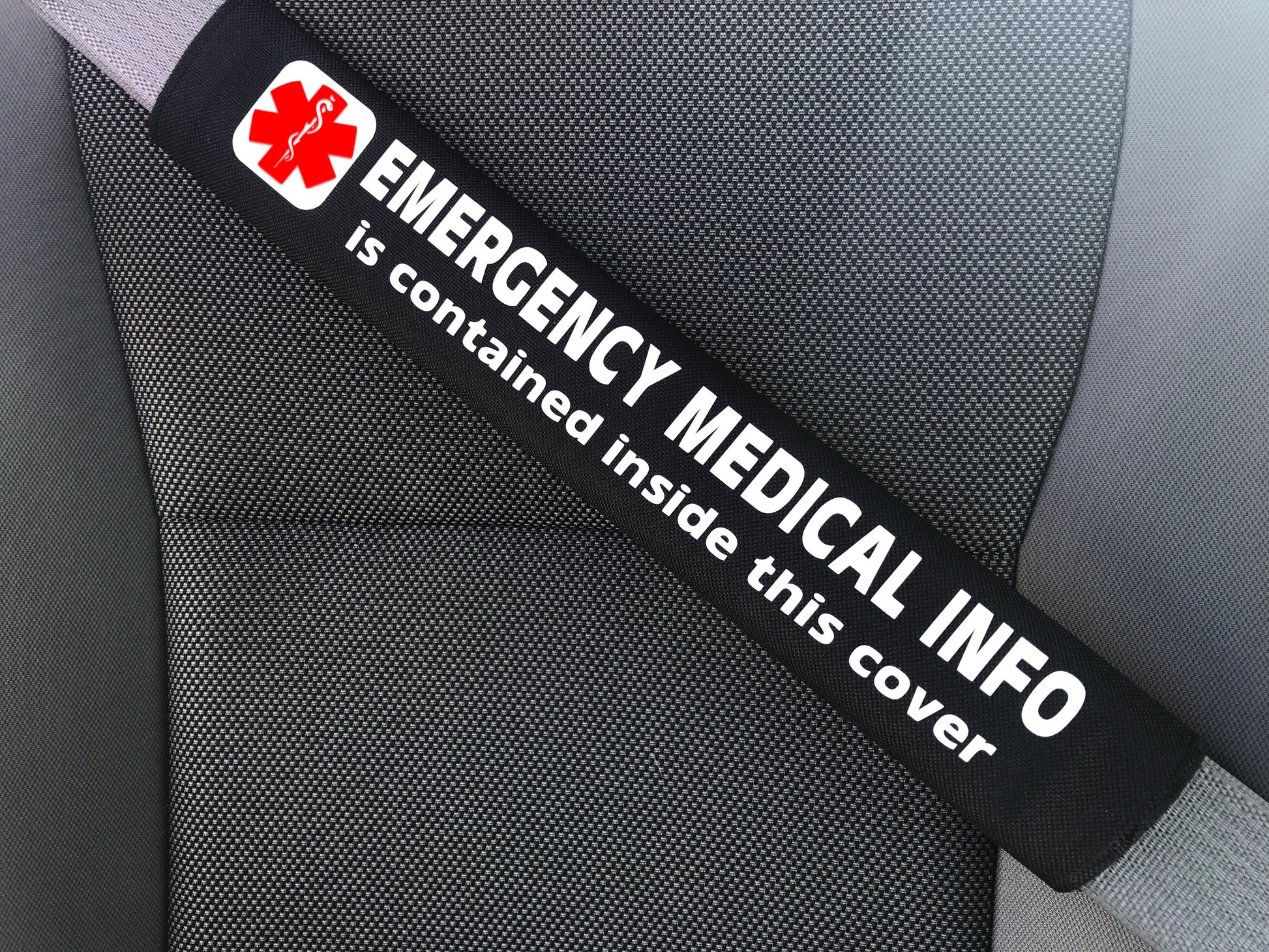 Medical alert seat belt cover with Emergency Medical Info strap label