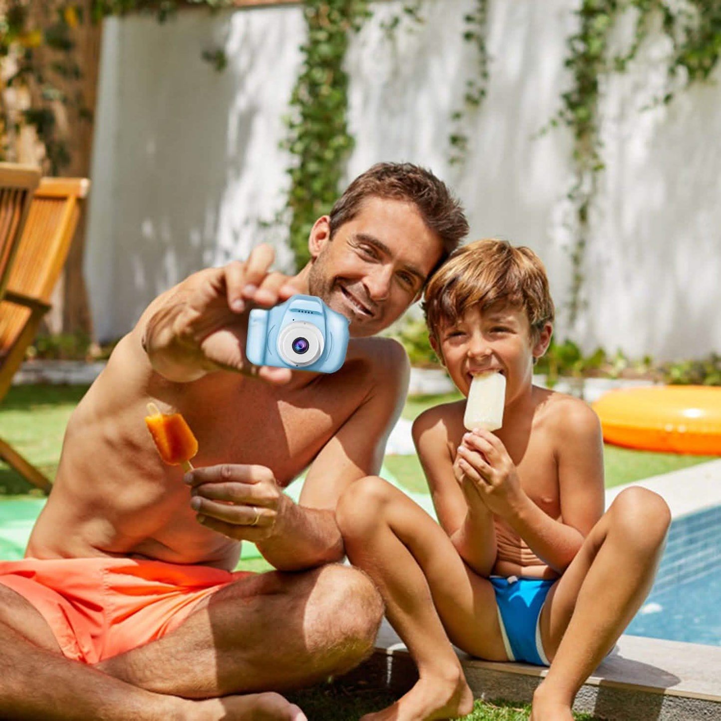 Blue handheld kids digital camera held by a child
