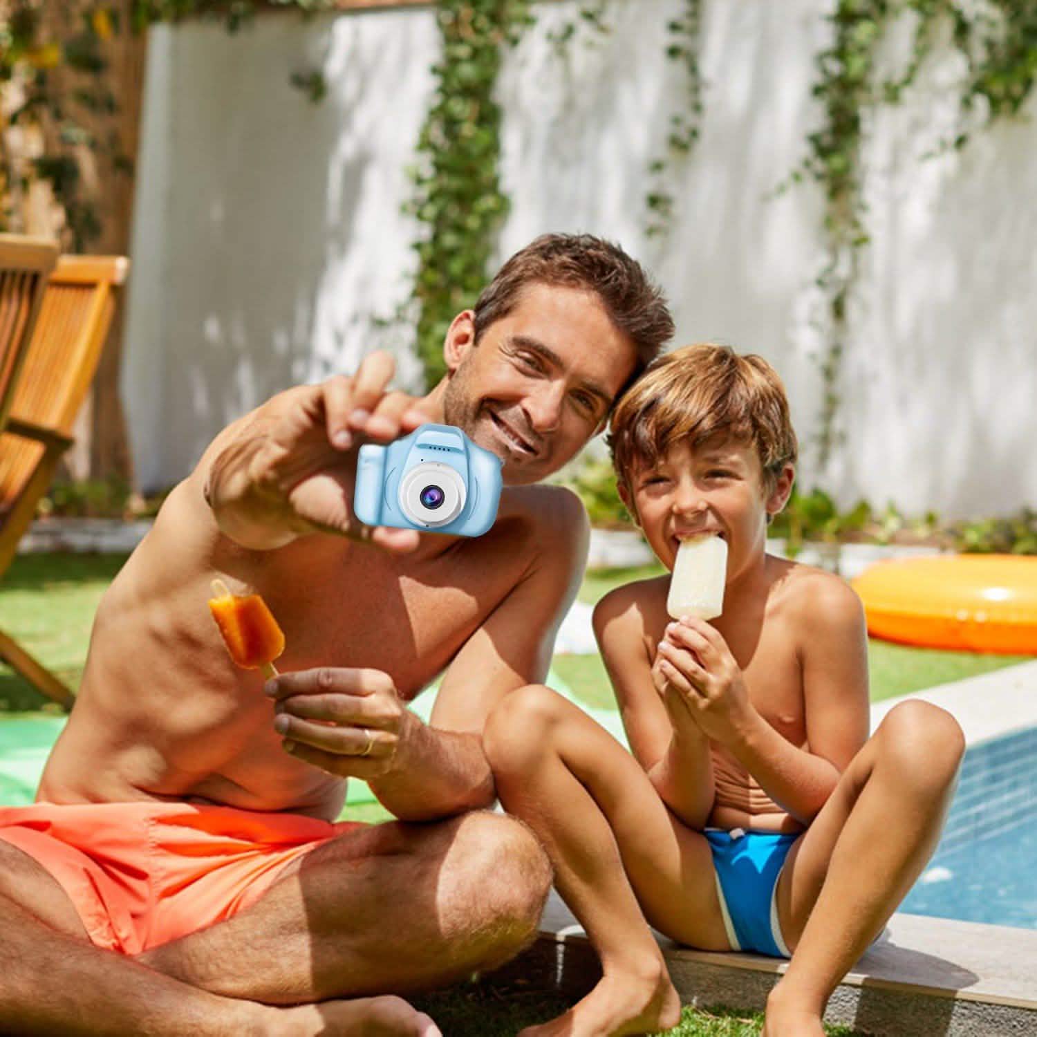 Blue handheld kids digital camera held by a child