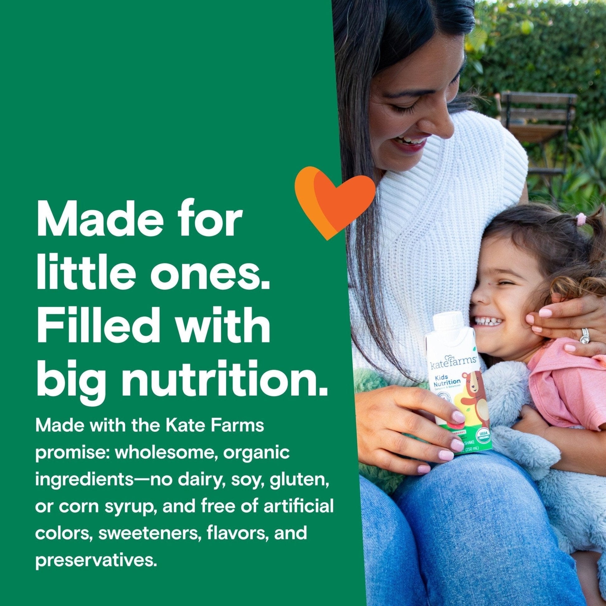 Child holding a Kids Nutrition Shake Strawberry carton