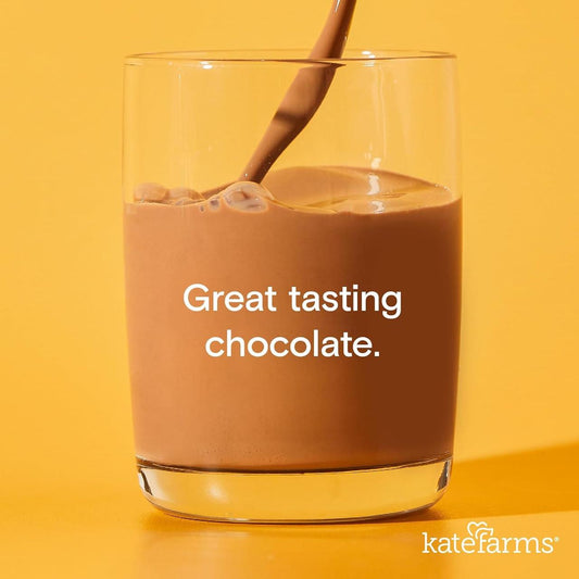 Glass of chocolate nutrition shake with straw