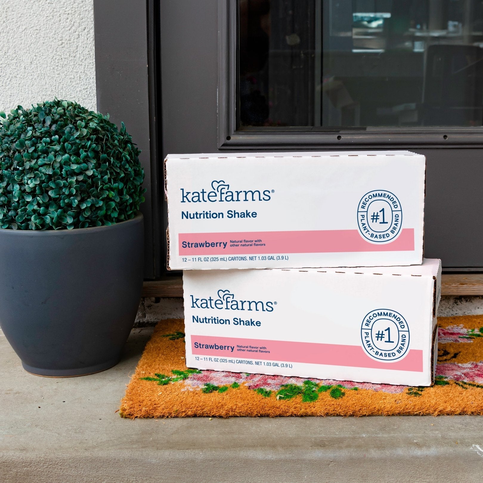 Strawberry Nutrition Shake boxes with carton packs stacked on a counter