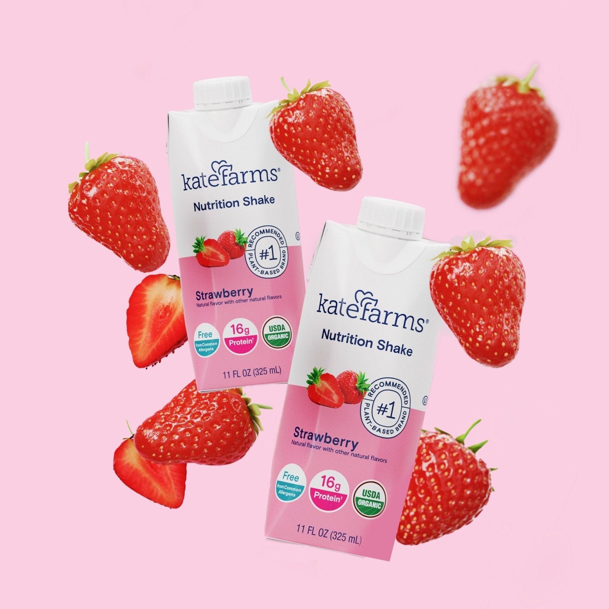 Strawberry Nutrition Shake cartons with strawberry fruit on a pink background