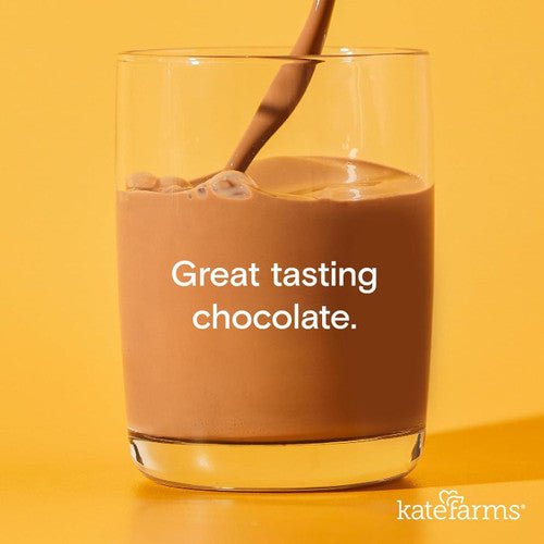 Chocolate formula drink in glass with straw