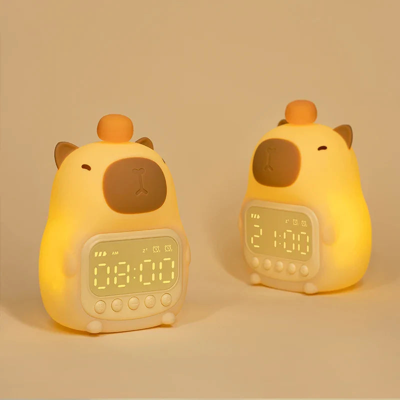 Capybara night light alarm clock shown from front and side with glowing screen