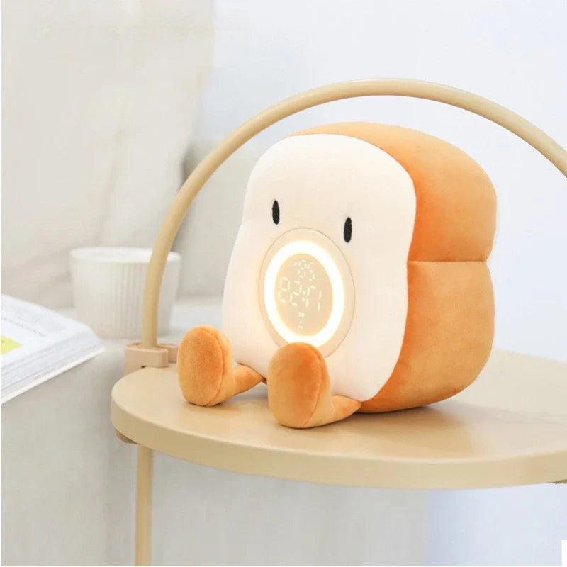 Plush toast-shaped alarm clock night light with glowing circular display