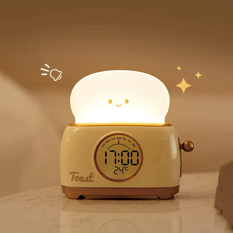 Toaster night light alarm clock with glowing white lid and digital time display