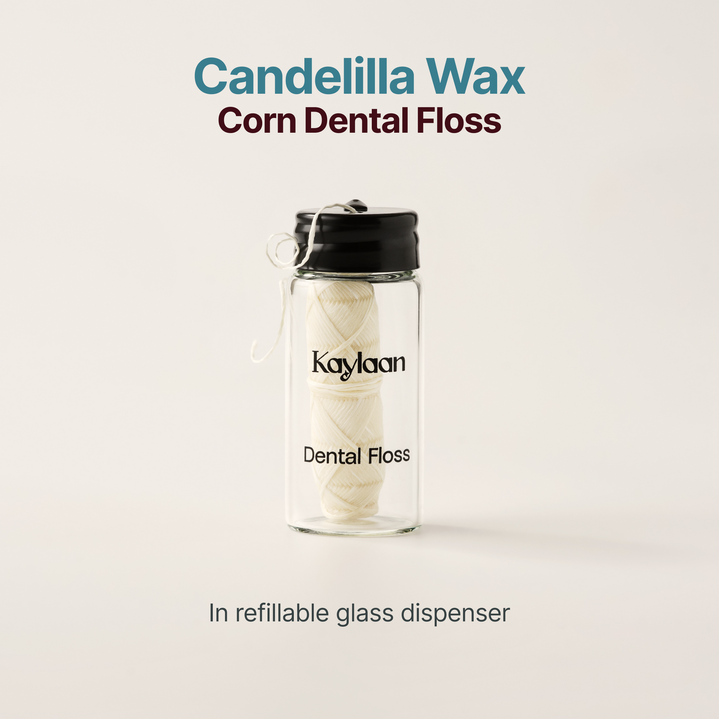 Candelilla wax dental floss in refillable glass dispenser, floss strips shown