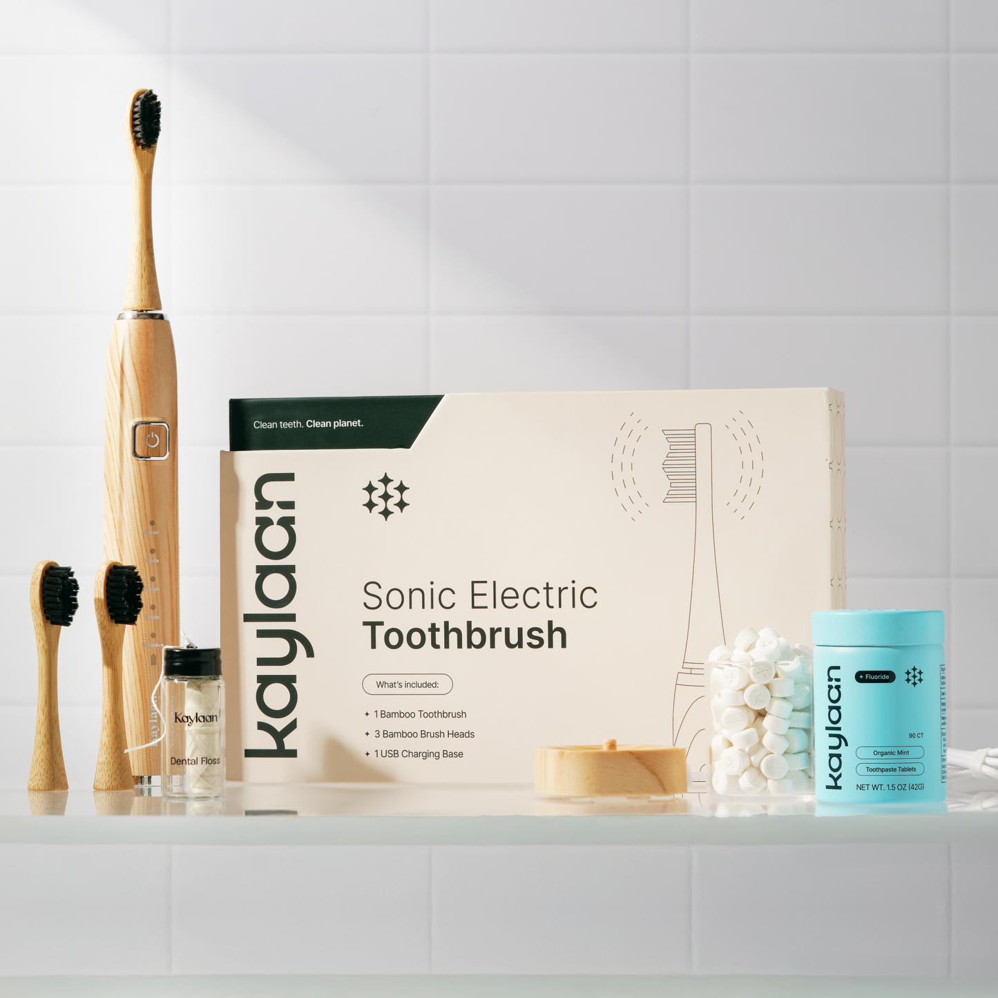 Sonic electric bamboo toothbrush kit with Kaylaan toothpaste and charging base