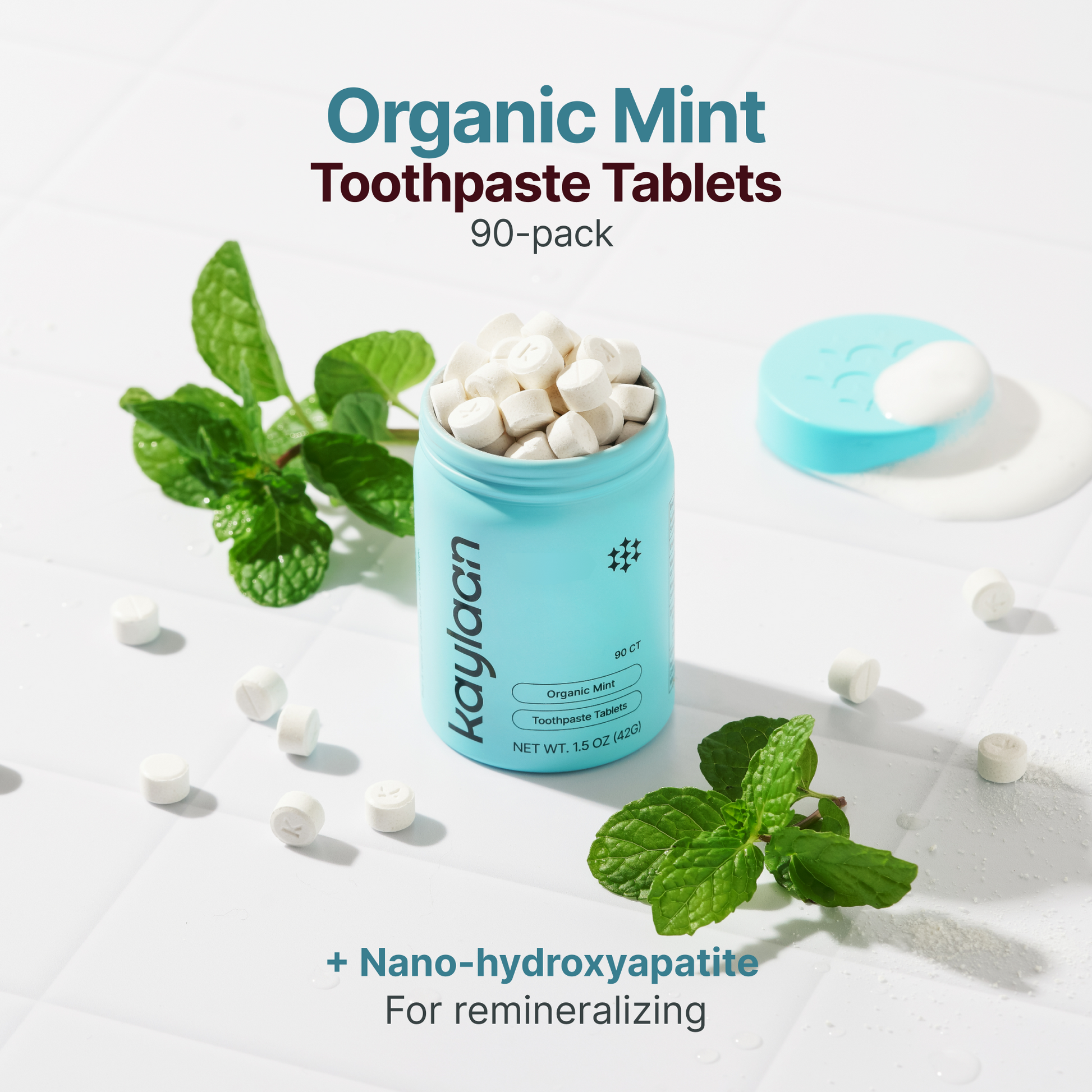 Organic mint toothpaste tablets jar with mint leaves and tablets, 90-pack