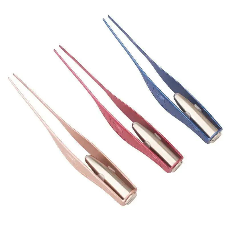 Ear pick and tweezer tools in multiple colors arranged together, metal tips visible
