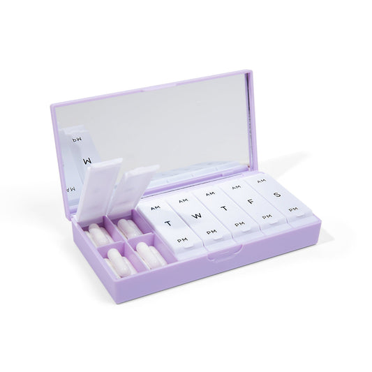 Lilac AM/PM pill box with open lid and labeled day-of-week pill compartments