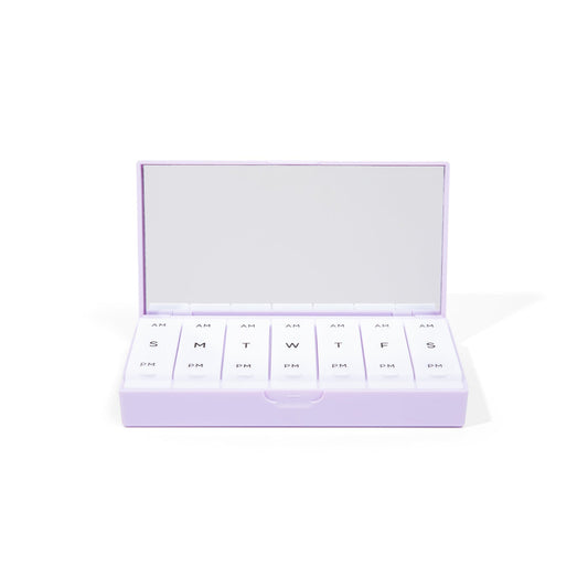 Lilac AM/PM pill box with open lid showing labeled pill slots for days