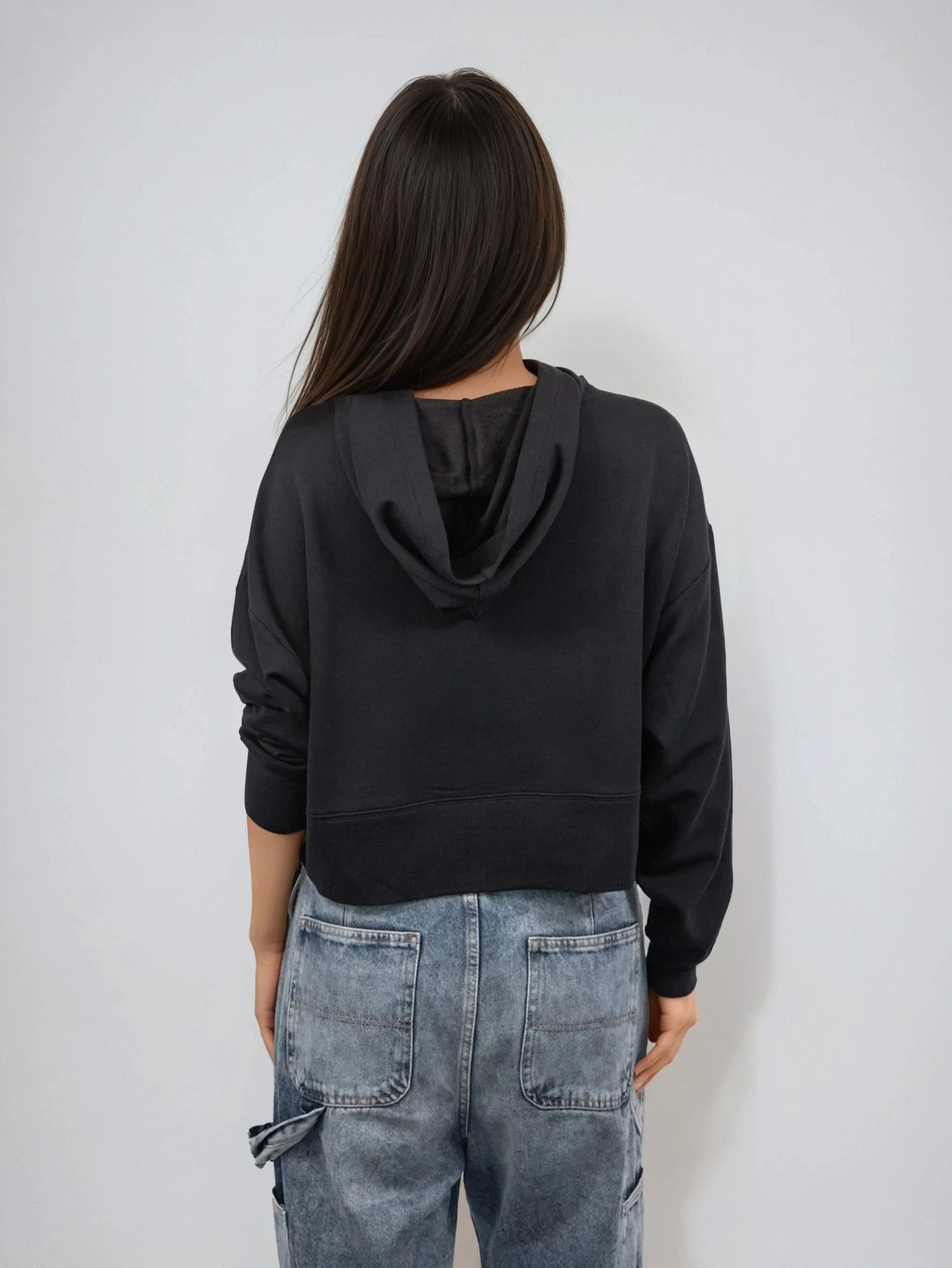 Black cropped hoodie back view with hood and kangaroo pocket opening