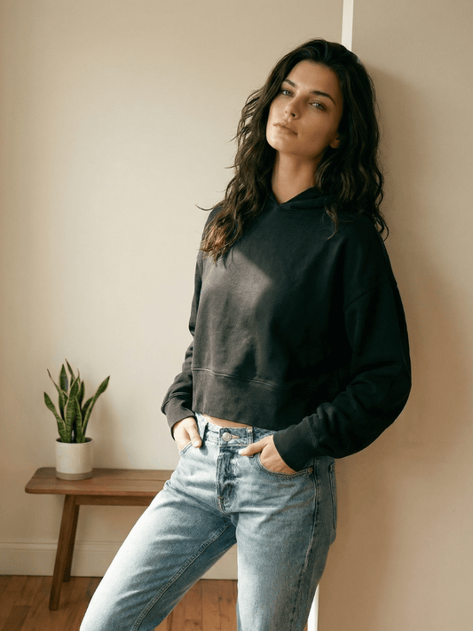 Black cropped pullover hoodie with hood and kangaroo pocket, long sleeves