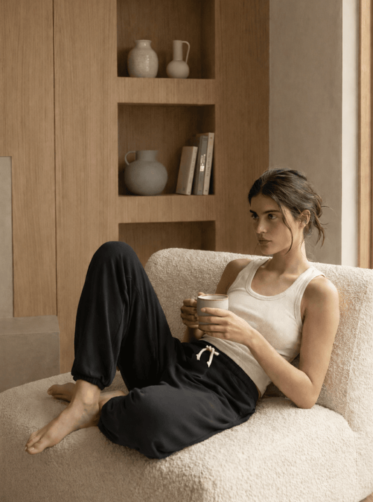 Black lounge sweatpants with elastic waistband and white drawstring