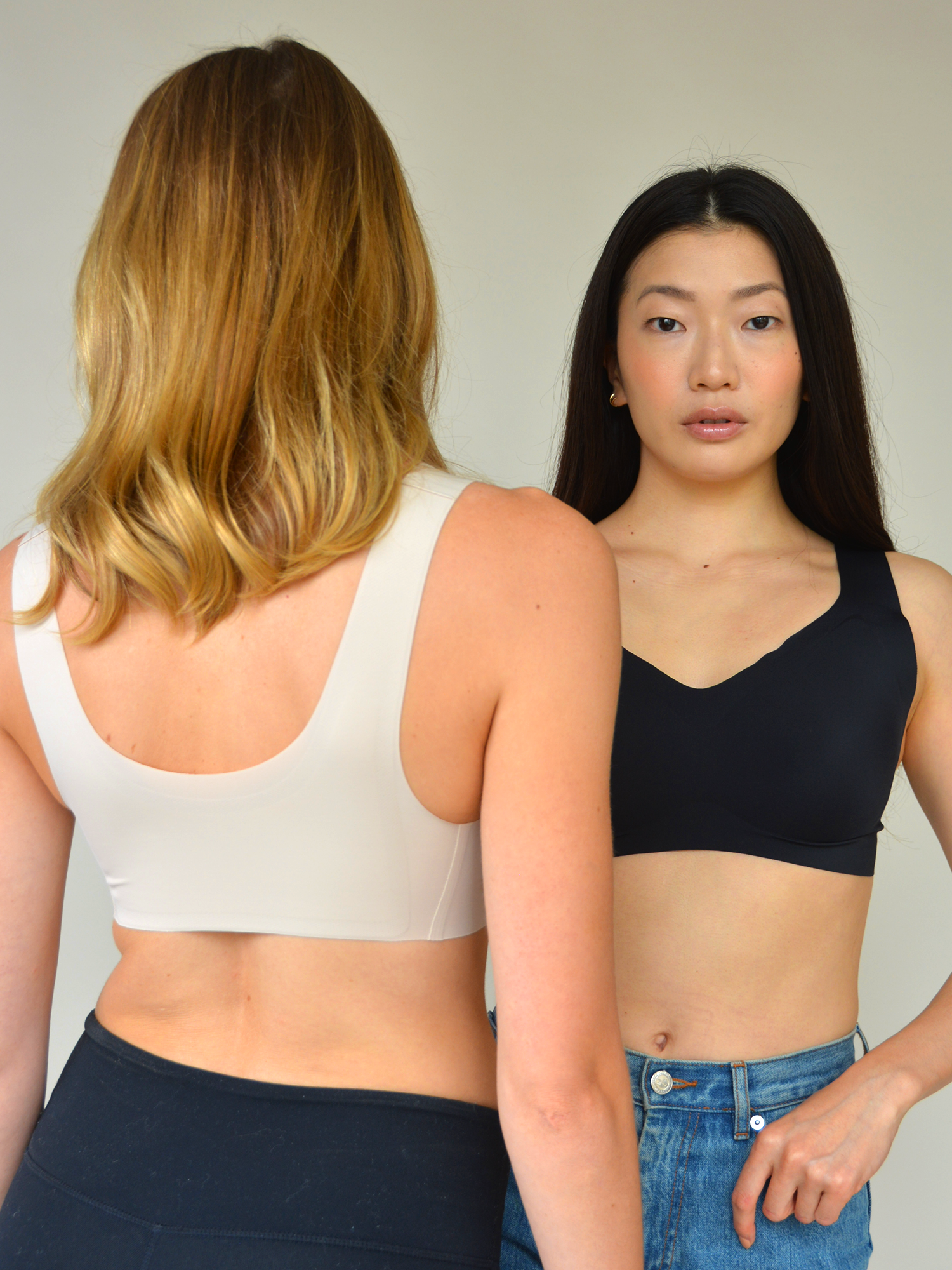 Black and white v-neck lift bras, front v-necks with molded cups.