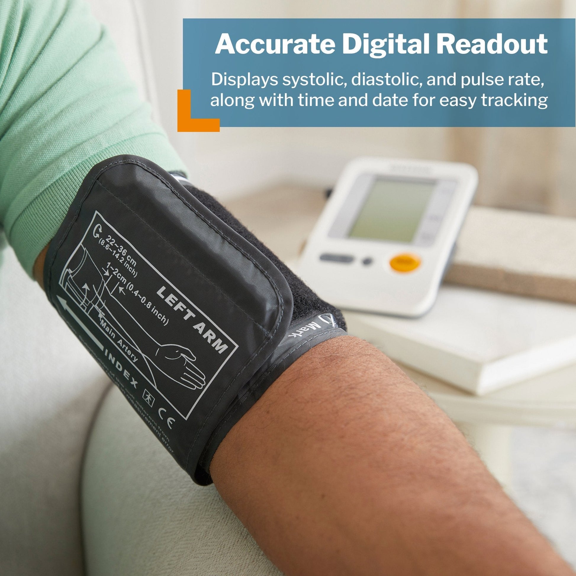 Left arm cuff attached to an arm with digital blood pressure monitor on nearby table