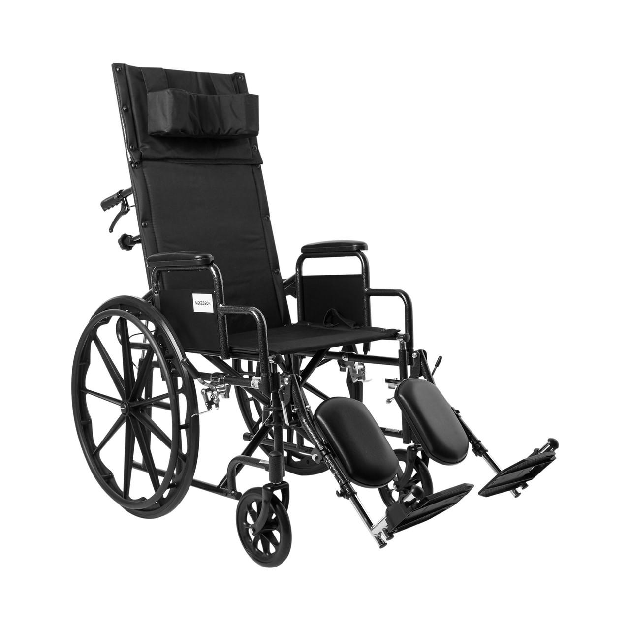 Reclining wheelchair with detachable desk arms, black padded seat and leg supports