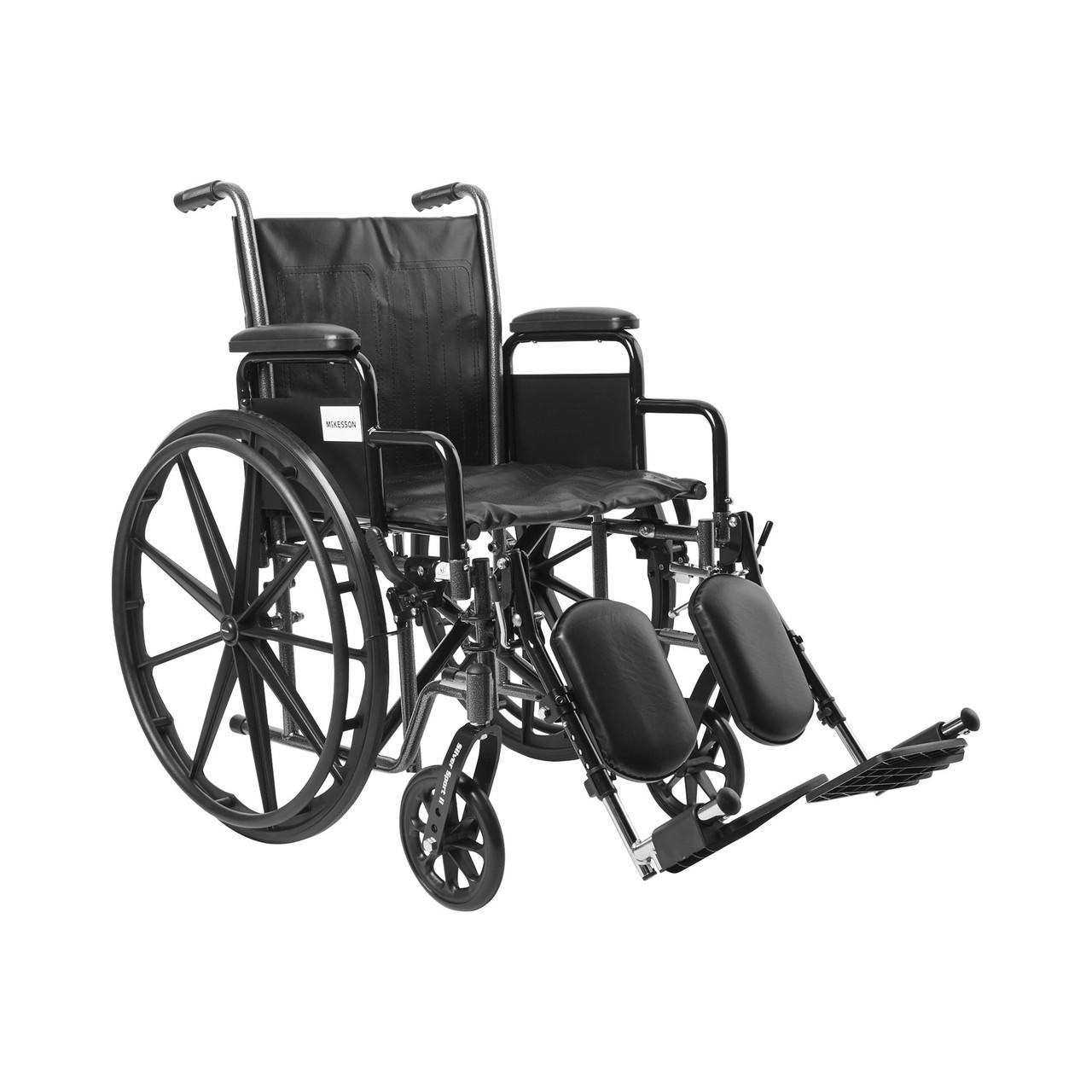 Black wheelchair with elevating swing-away footrests and desk arms, 18-inch