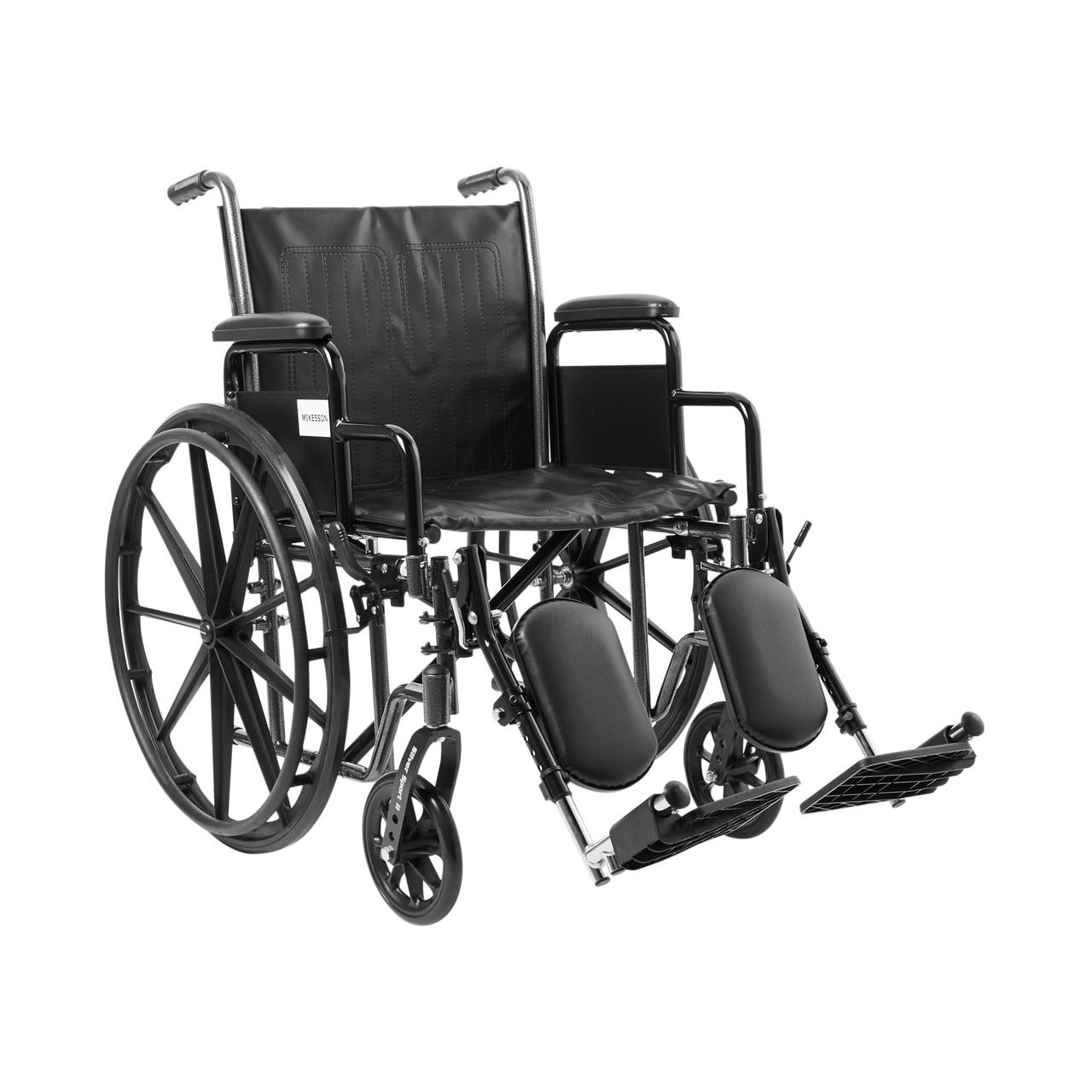 Black wheelchair with elevating swing-away footrests and desk-style detachable arms