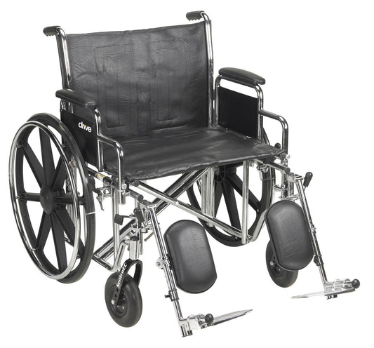 Wheelchair with padded back, detachable desk arms, and elevated footrests; black upholstery