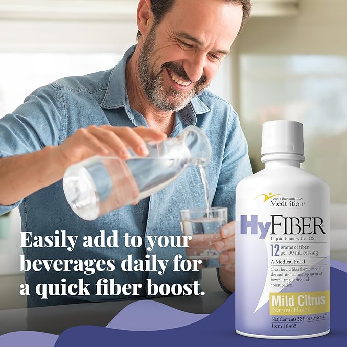 HyFiber mild citrus liquid fiber bottle beside a glass of water