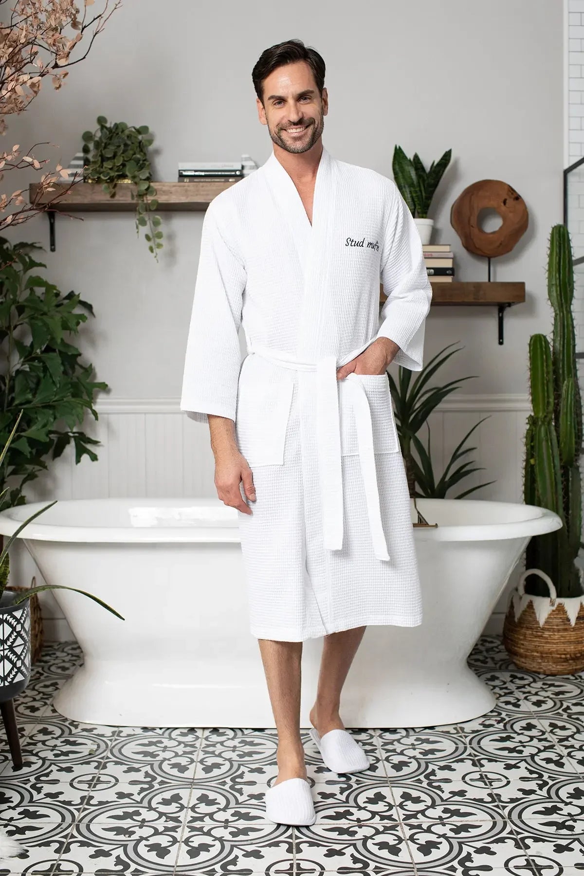 Men's waffle spa bathrobe in white, belted waffle-knit V-neck with front pocket.